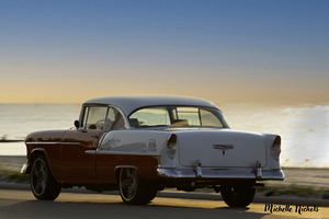 Red and White Classic Car on the Beach by Michelle Nichols