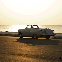 White Classic Convertible On The Beach